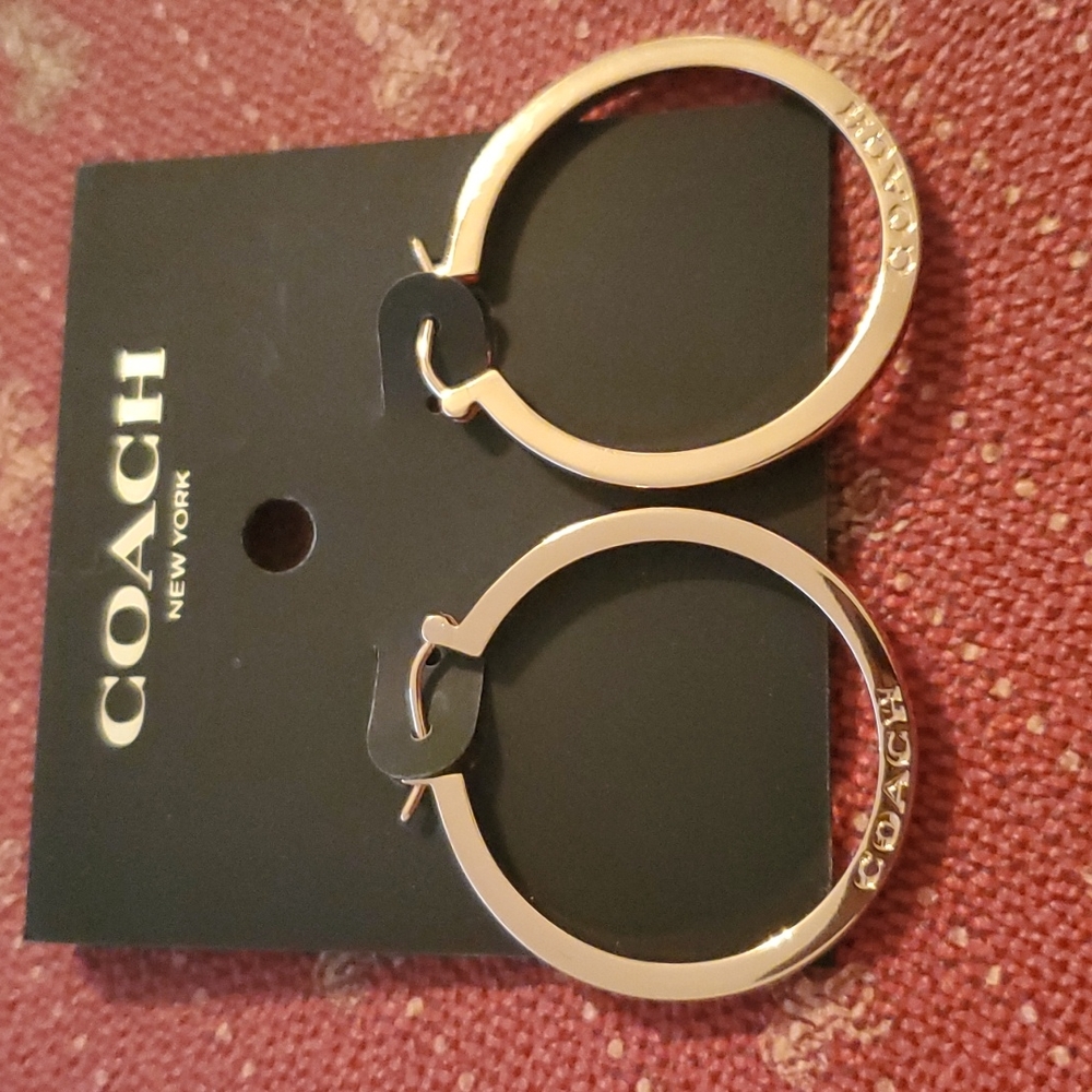 COACH ROSEGOLD MEDIUM THICK HOOP EARRINGS WITH COACH ETCHED IN THEM ON BOTH SIDE